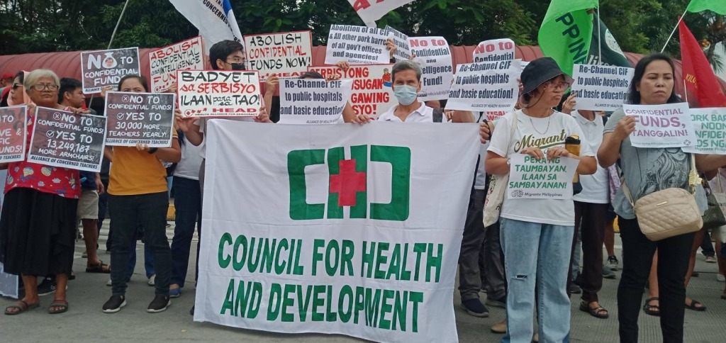 CHD, CPRH together with various sectors and organizations staged a protest action in front of the Senate of the Philippines against budget cuts on health, education and other social services.